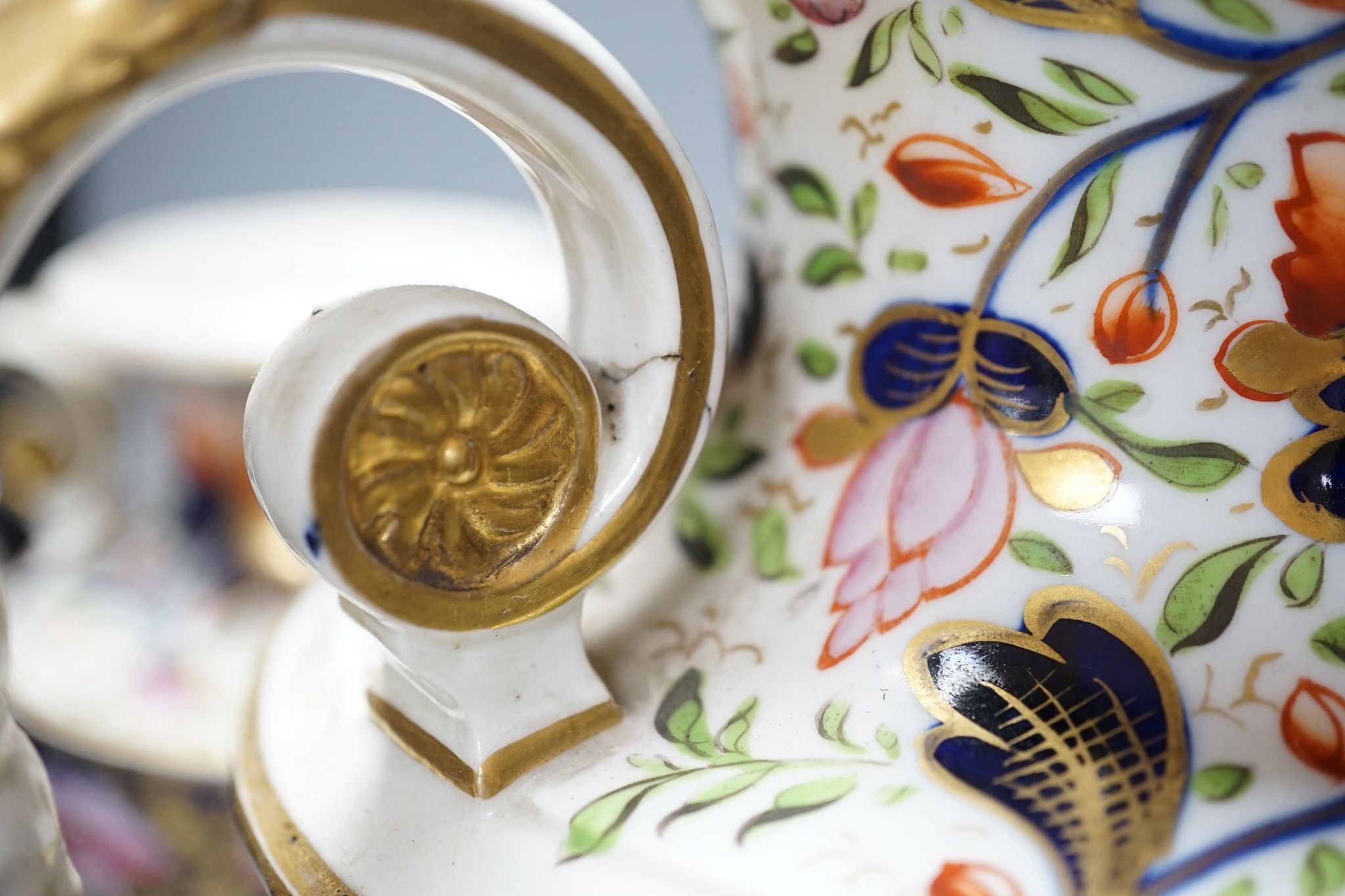 An early 19th century Derby garniture of Imari style vases 29cm